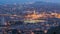 Barcelona and Badalona skyline with roofs of houses and sea on the horizon day to night