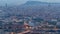 Barcelona and Badalona skyline with roofs of houses and sea on the horizon day to night
