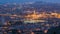 Barcelona and Badalona skyline with roofs of houses and sea on the horizon day to night timelapse