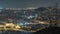 Barcelona and Badalona skyline with roofs of houses and sea on the horizon night