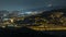 Barcelona and Badalona skyline with roofs of houses and sea on the horizon night