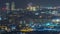 Barcelona and Badalona skyline with roofs of houses and sea on the horizon night timelapse