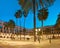 Barcelona at night in golden light and blue. Panoramic image of illuminated Plaza Real in in Gothic quarter of Barcelona,