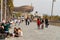 Barcelona, people walk along the Avenue Maritim De La Barceloneta