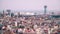 Barcelona rooftops and distant seaport, Spain