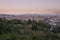 Barcelona skyline during sunset from city park Jardins del Mirador