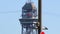 Barcelona, Spain - 05 26 2022: Closeup Cableway Teleferico del Puerto. Red Cable Cab Passes Station on Hot Day. High quality 4k