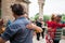 Barcelona, Spain - 10 july 2019: adult couples dancing argentinian tango in outdoors park moving close to each other