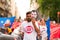 Barcelona, spain- 17 july 2019: young open arms activist march holding rubber dinghy and italian minister Salvini mask against