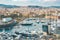 Barcelona, Spain - 22 April 2018 View on the city and sea port Barceloneta with yachts from high point