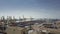 BARCELONA, SPAIN - APRIL, 15, 2017. Aerial shot of harbour cranes, port storage facility and big container yard. 4K