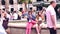 BARCELONA, SPAIN - APRIL, 16, 2017. Two young women examining city tourist guide books near the fountain. 4K clip