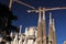 Barcelona, Spain, August 2016. Towers of the Sagrada Familia Cathedral under construction and construction cranes.