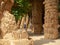 Barcelona, Spain - august 2019: tourists walking between brick columns and arches, long view. Park Guell in Barcelona