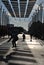 BARCELONA, SPAIN - DECEMBER 2017: Backlit boy skating in a streer under parasols in a quiet winter morning.