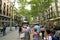 BARCELONA, SPAIN - JULY 13, 2018: La Rambla, thousands of people walk daily by this popular pedestrian area 1.2 kilometer-long