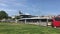 Barcelona, Spain, June 20 2019: A large jetliner sitting on top of a grass covered field