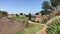 Barcelona, Spain. A large brick building with grass and dirt