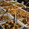 Barcelona Spain Market Variety assortment diverse of fresh healthy tasty green and black olives bowls for sale on open
