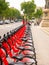 Barcelona, Spain. May 2019 : Row of red bicycles in a bike rack, available for rental on the streets of Barcelona