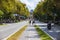 Barcelona, Spain - September 20, 2021: Bicycle lane on avenue Sant Joan. Cityscape with cyclists in the middle lane. Tourist and