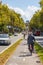 Barcelona, Spain - September 20, 2021: Bicycle lane on avenue Sant Joan. Cityscape with cyclists in the middle lane. Tourist and