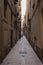 Barcelona, Spain - September 23, 2021: View into the narrow streets of the city. Beside the big boulevards narrow alleys