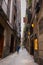 Barcelona, Spain - September 23, 2021: View into the narrow streets of the city. Beside the big boulevards narrow alleys