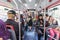 Barcelona, Spain - September 24, 2021: Crowds of people inside a bus. Interior view of a municipal bus with passengers wearing