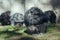 Barcelona Zoo, Barcelona Spain April 20, 2017 - Group of Chimpanzees sitting in the sun resting and eating at the Barcelona Zoo.