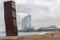 Barceloneta beach with sculpture L Estel ferit The Wounded Shooting Star, by Rebecca Horn; and hotel W at background. Barcelona