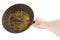 bare caucasian hand holding empty old cast iron frying pan