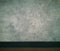 Bare cement wall surface and Baseboard,
