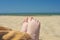 Bare children`s feet on the beach. close-up