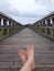 Bare feet on a pier