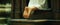 Bare feet of a pilgrim tramp praying in church. God-fearing woman prays in church.