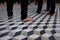 Bare Feet of Pilgrims on Tile Floor