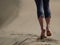 Bare feet of young woman jogging/walking on the beach