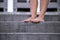 Bare female feet on the stairs