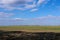 bare field, little vegetation ready for planting, warm summer, good weather, open field