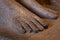 Bare foot of a carved marble statue in the museum there are many hard feet of ancient and historical style in greek art room