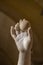 Bare hand of a carved marble statue in the museum there are many hard feet of ancient and historical style in greek art room