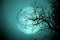 Bare tree on full moon at night. Elements of this image furnished by NASA