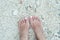 Bare woman\'s feet on the beach