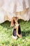 Barefoot bride on grass with shoes