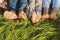 Barefoot family lying on grass in park