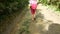 Barefoot girl walks through the mud