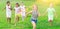 Barefoot kids running on green grass
