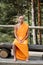 barefoot man in buddhist traditional robe