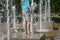 Barefoot person standing in a marble fountain